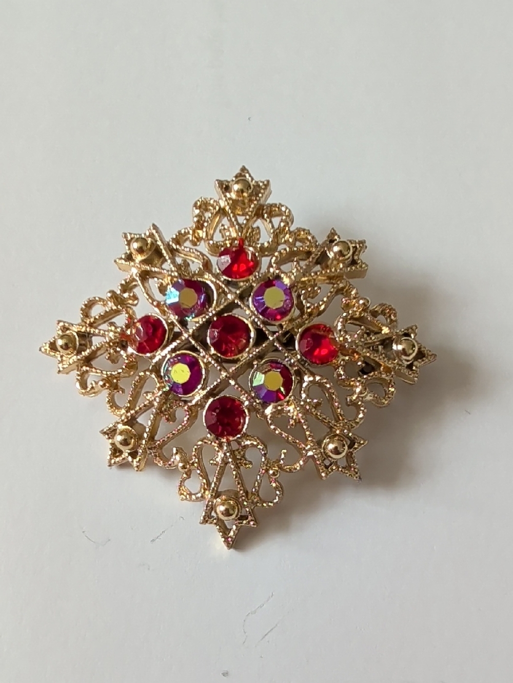Gold-Tone Red Crystal Filigree Brooch